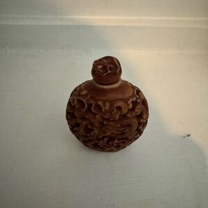 Hand carved Cinnabar snuff bottle.